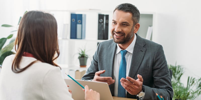 Smiling financial advisor engaging in productive client communication